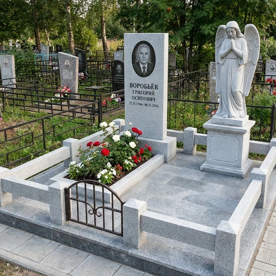 Памятник со скульптурой ангела из серого гранита